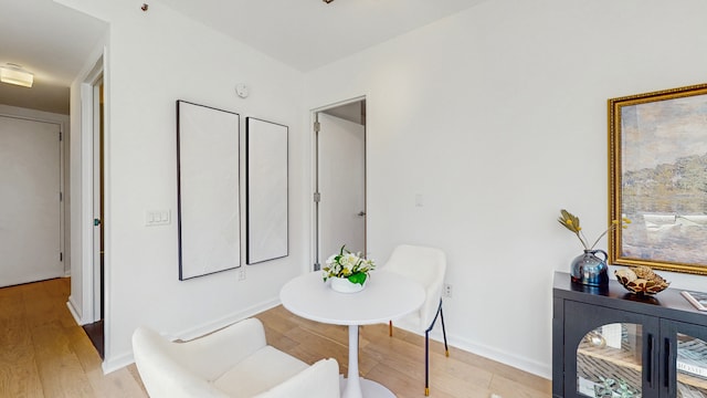 310 W 52nd St Unit 17A, New York City, NY 10019 - dining space featuring light wood-style flooring and baseboards