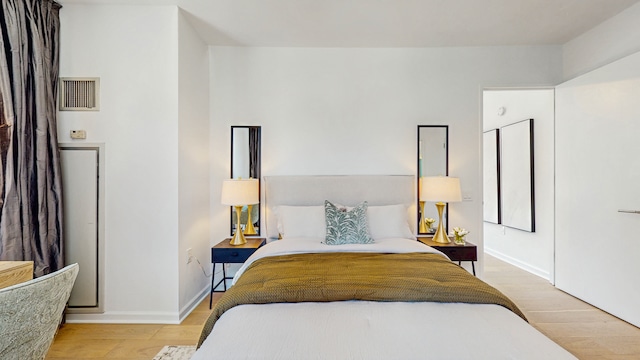 310 W 52nd St Unit 17A, New York City, NY 10019 - bedroom featuring light wood finished floors and baseboards