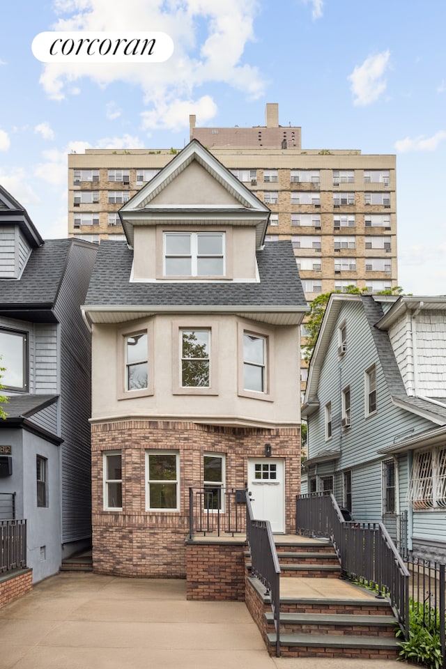580 E 7th St, New York City, NY 11218 - townhome / multi-family property with stucco siding and roof with shingles