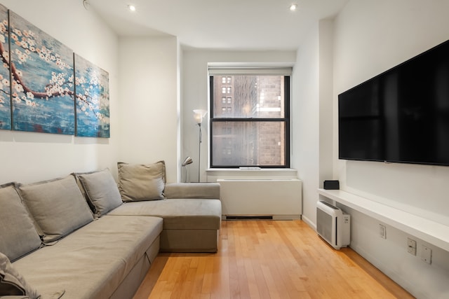 20 W St Unit 15H, New York City, NY 10004 - living area featuring light wood finished floors and recessed lighting