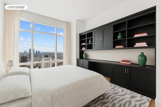 151 E 58th St Unit 42C, New York City, NY 10022 - bedroom featuring a view of city