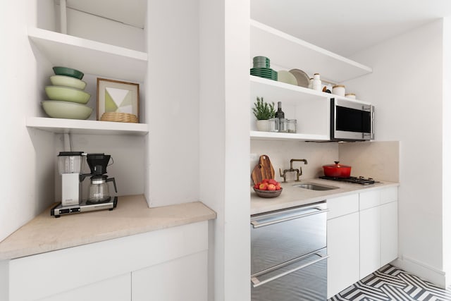 500 W 43rd St Unit 3C, New York City, NY 10036 - indoor wet bar with stainless steel microwave and dishwashing machine
