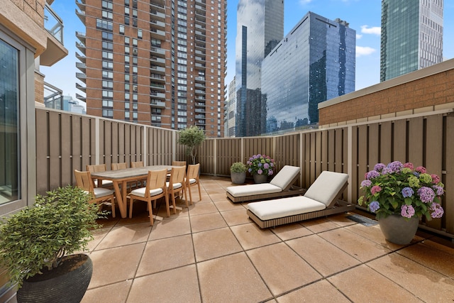500 W 43rd St Unit 3C, New York City, NY 10036 - view of patio / terrace with a view of city and outdoor dining area