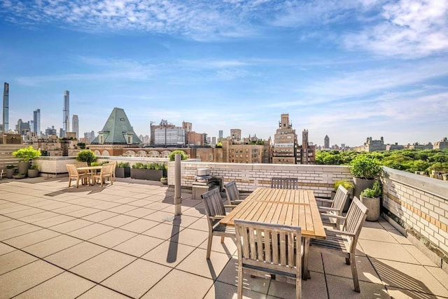 40 E 78th St Unit 6H, New York City, NY 10075 - view of patio with outdoor dining area and a skyline view