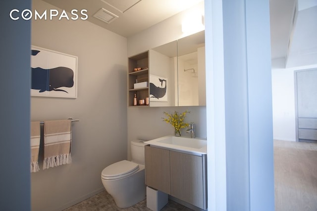 1 John St Unit 3B, New York City, NY 11201 - bathroom with vanity, toilet, and baseboards