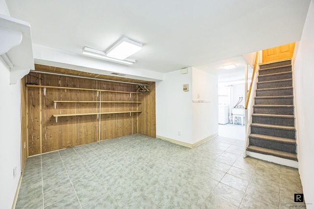 118 Stobe Ave, New York City, NY 10306 - empty room featuring washer / clothes dryer, stairway, and baseboards