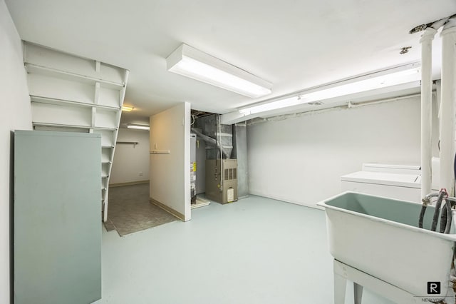 118 Stobe Ave, New York City, NY 10306 - finished basement with a sink, heating unit, and gas water heater