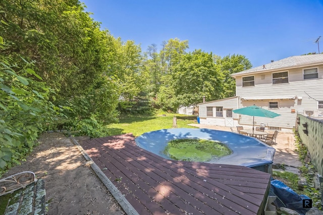118 Stobe Ave, New York City, NY 10306 - wooden terrace featuring a yard