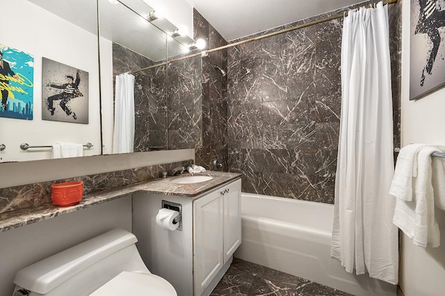 201 E 80th St Unit 4A, New York City, NY 10021 - full bathroom featuring marble look tile flooring, shower / bath combo, toilet, and vanity