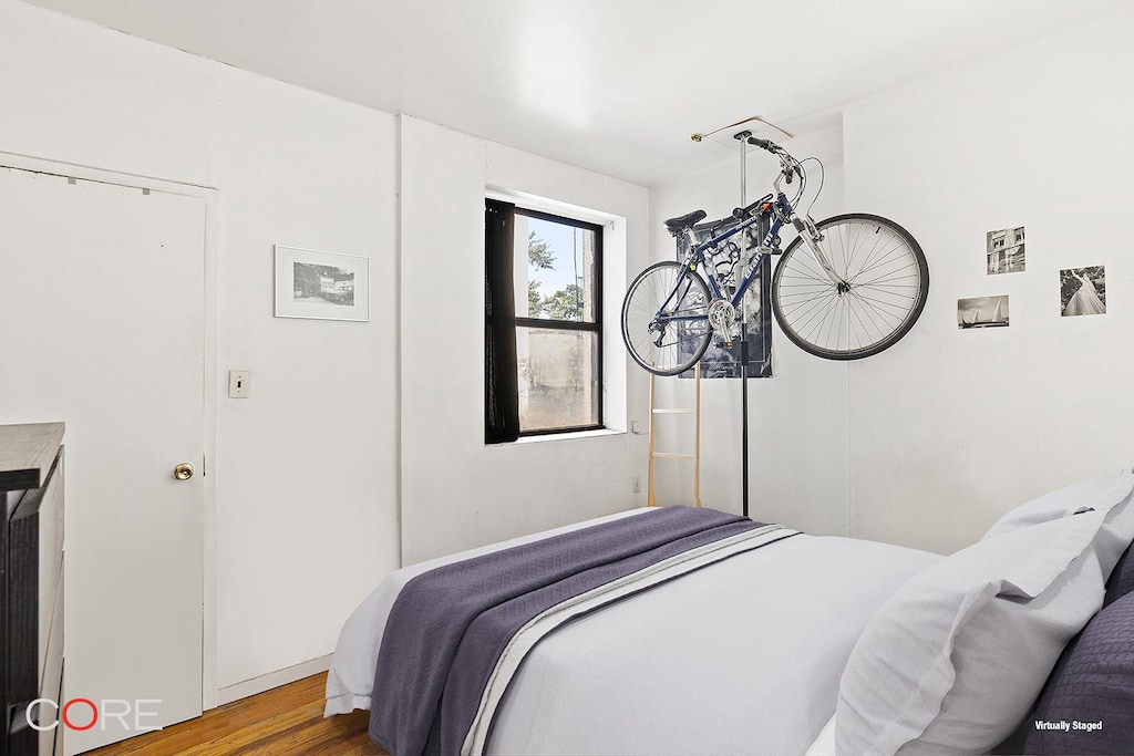 105 E 100th St Unit 3A, New York City, NY 10029 - bedroom with wood finished floors