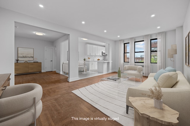 43-25 43rd St Unit 5D, New York City, NY 11104 - living area with recessed lighting, wood finished floors, and baseboards