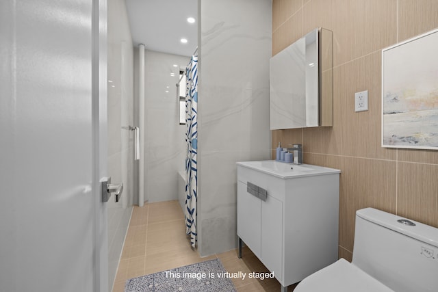 43-25 43rd St Unit 5D, New York City, NY 11104 - bathroom featuring vanity, curtained shower, toilet, tile patterned flooring, and recessed lighting