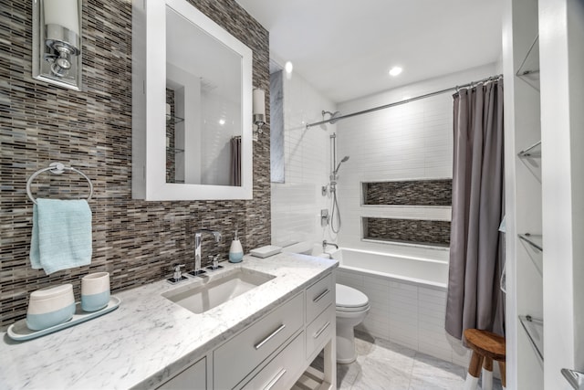 59 W 71st St Unit 4D, New York City, NY 10023 - bathroom featuring tiled shower / bath, toilet, vanity, tile walls, and backsplash