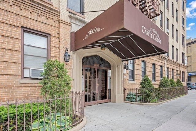 7609 4th Ave Unit D9, New York City, NY 11209 - view of exterior entry with brick siding and cooling unit