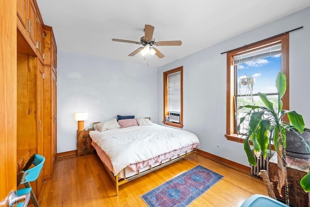 7609 4th Ave Unit D9, New York City, NY 11209 - bedroom featuring light wood-style floors, a ceiling fan, and cooling unit