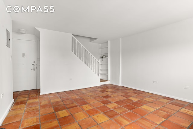 609 Columbus Ave Unit 14E, New York City, NY 10024 - empty room featuring stairs and a smoke detector