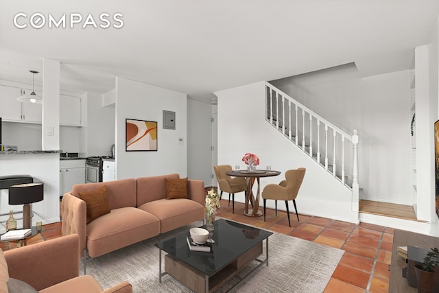 609 Columbus Ave Unit 14E, New York City, NY 10024 - living area featuring stairs and light tile patterned floors