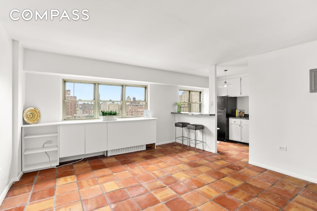 609 Columbus Ave Unit 14E, New York City, NY 10024 - empty room with healthy amount of natural light and light tile patterned floors