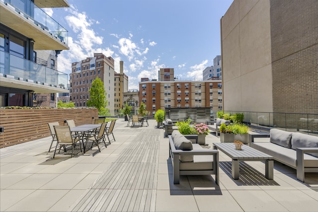 11 Hancock Pl Unit 304, New York City, NY 10027 - view of patio with outdoor lounge area, outdoor dining area, and a city view