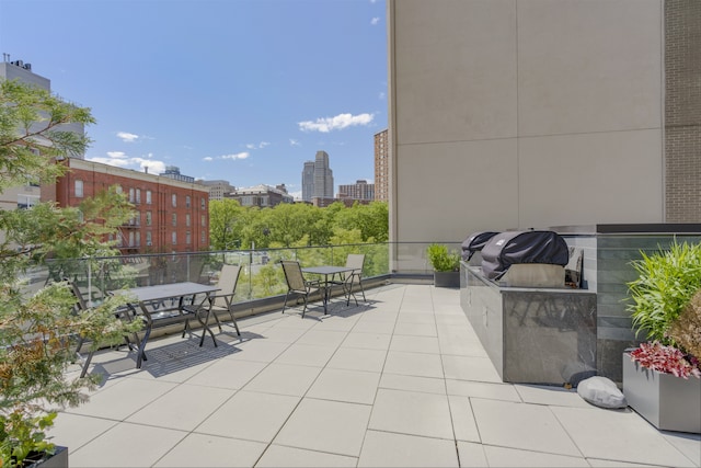 11 Hancock Pl Unit 304, New York City, NY 10027 - view of patio featuring a city view, a balcony, and outdoor dining area