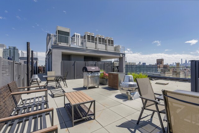 11 Hancock Pl Unit 304, New York City, NY 10027 - view of patio featuring a city view and grilling area