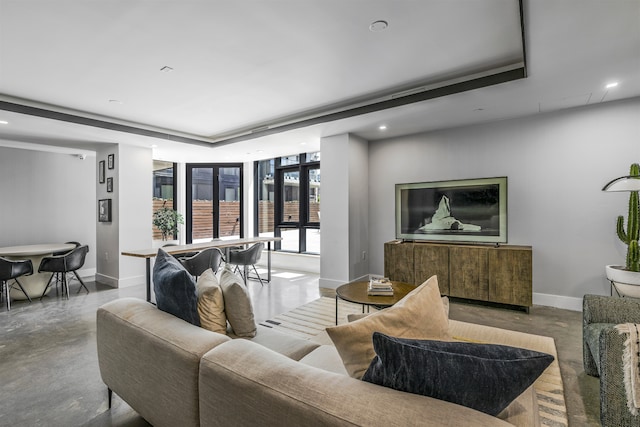 11 Hancock Pl Unit 304, New York City, NY 10027 - living area featuring a raised ceiling, concrete flooring, baseboards, recessed lighting, and a wall of windows