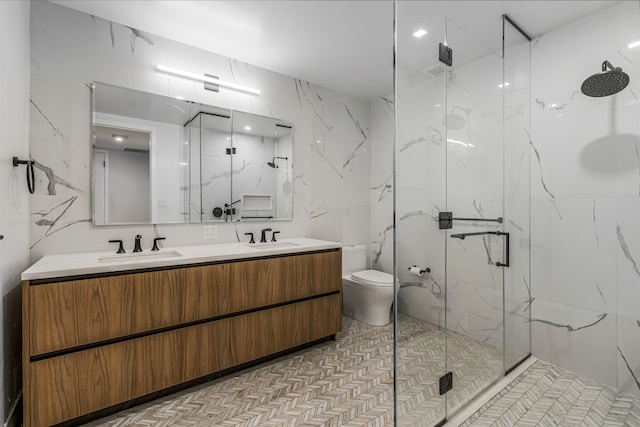 11 Hancock Pl Unit 304, New York City, NY 10027 - full bathroom featuring a marble finish shower, double vanity, and toilet
