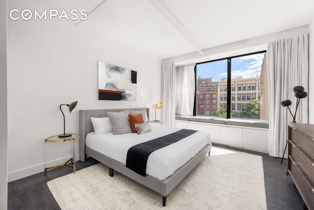 36 W 15th St Unit 4, New York City, NY 10011 - bedroom with dark wood-type flooring and baseboards