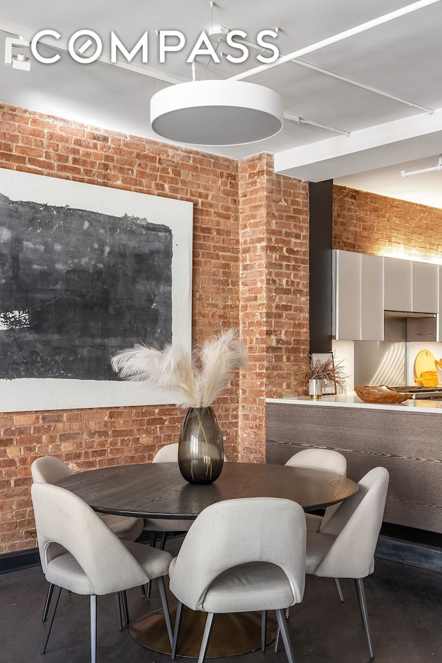 36 W 15th St Unit 4, New York City, NY 10011 - dining area featuring brick wall