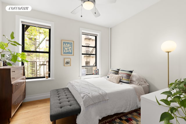 466 15th St Unit 11, New York City, NY 11215 - bedroom with multiple windows, baseboards, light wood-style floors, and a ceiling fan
