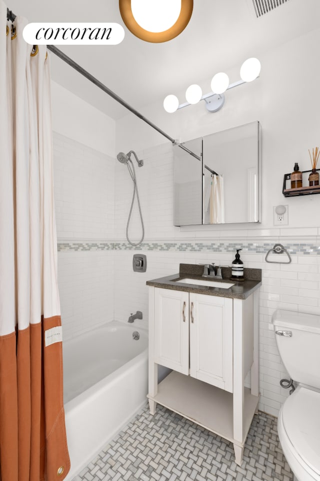 466 15th St Unit 11, New York City, NY 11215 - full bath featuring tile walls, shower / bath combo with shower curtain, toilet, and vanity