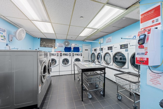201 E 36th St Unit 14F, New York City, NY 10016 - community laundry room with separate washer and dryer and dark tile patterned flooring