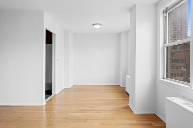 201 E 36th St Unit 14F, New York City, NY 10016 - hall with light wood-style floors and baseboards