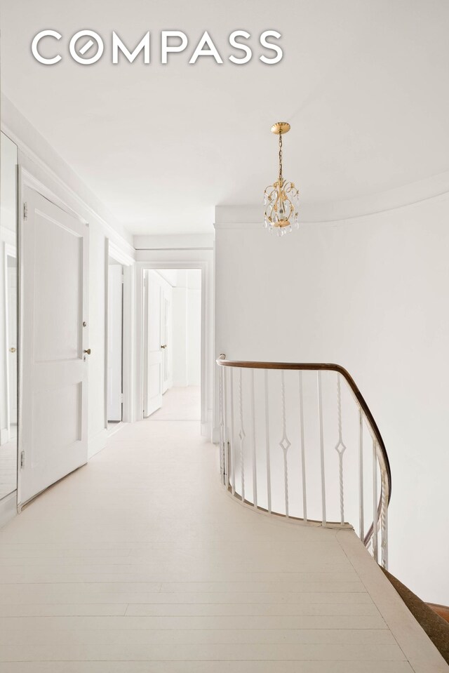 12 E 88th St Unit Ph11/12B, New York City, NY 10128 - hall featuring a chandelier and an upstairs landing