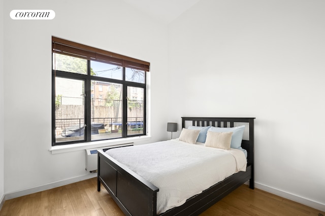 715 Prospect Pl Unit 1B, New York City, NY 11216 - bedroom featuring wood finished floors and baseboards