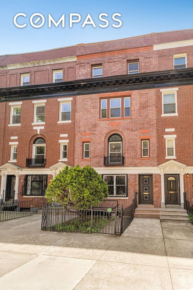 1050 Sterling Place, New York City, NY 11213 - view of building exterior with a fenced front yard