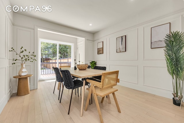1050 Sterling Place, New York City, NY 11213 - dining area with a decorative wall, light wood-style floors, and recessed lighting