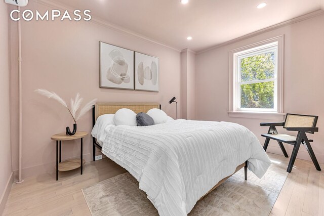 1050 Sterling Place, New York City, NY 11213 - bedroom with crown molding, light wood-type flooring, baseboards, and recessed lighting