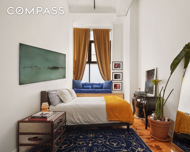 138 Broadway Unit 1D, New York City, NY 11211 - bedroom featuring wood finished floors and multiple windows