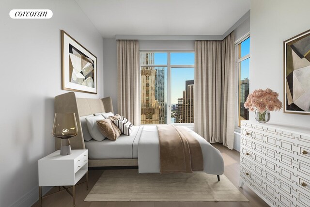 30 Park Pl Unit 60C, New York City, NY 10007 - bedroom featuring multiple windows and wood finished floors
