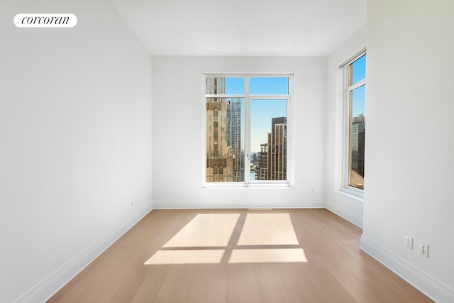 30 Park Pl Unit 60C, New York City, NY 10007 - unfurnished room with wood finished floors and baseboards