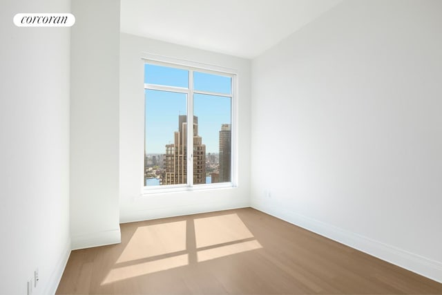 30 Park Pl Unit 60C, New York City, NY 10007 - spare room with wood finished floors and baseboards