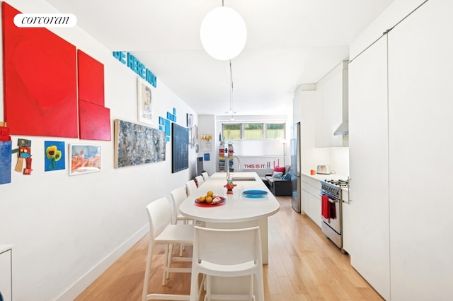 305 E 24th Street Lf, New York City, NY 10010 - dining room with light wood-style floors