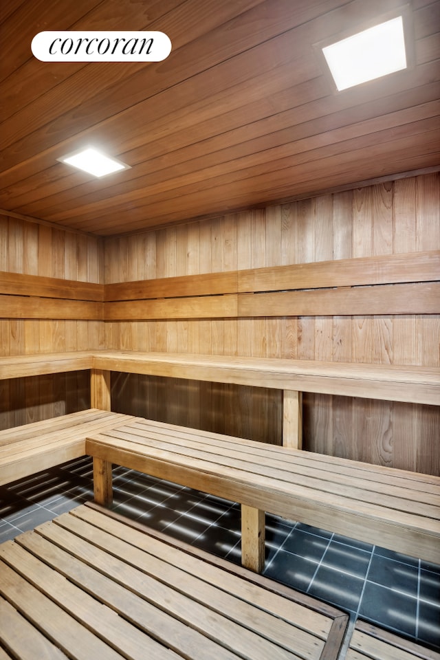 531 Main St Unit 1107, New York City, NY 10044 - relaxing sauna with wood walls and tile patterned floors