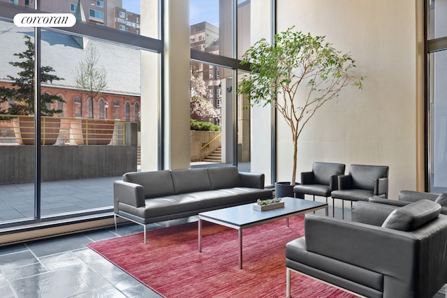 531 Main St Unit 1107, New York City, NY 10044 - building lobby featuring expansive windows and a high ceiling