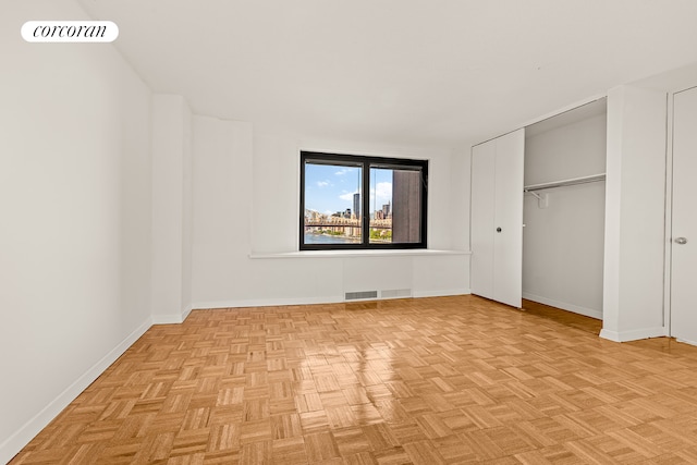 531 Main St Unit 1107, New York City, NY 10044 - unfurnished bedroom featuring baseboards