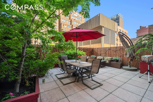 301 E 62nd St Unit 2K, New York City, NY 10065 - fenced backyard featuring a patio area, grilling area, and outdoor dining space