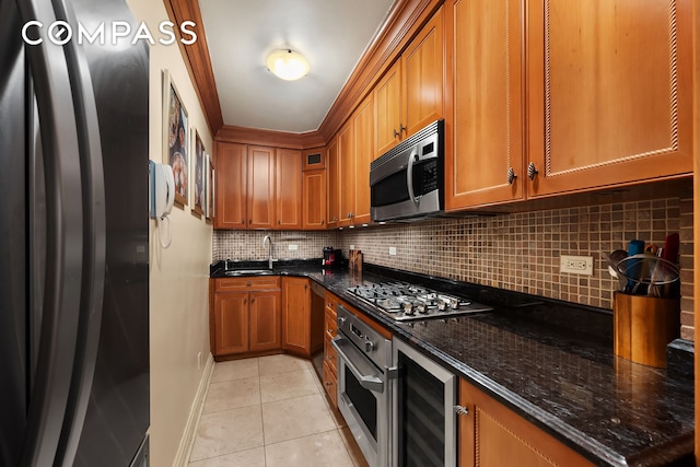 301 E 62nd St Unit 2K, New York City, NY 10065 - kitchen featuring stainless steel appliances, wine cooler, brown cabinetry, light tile patterned floors, and tasteful backsplash
