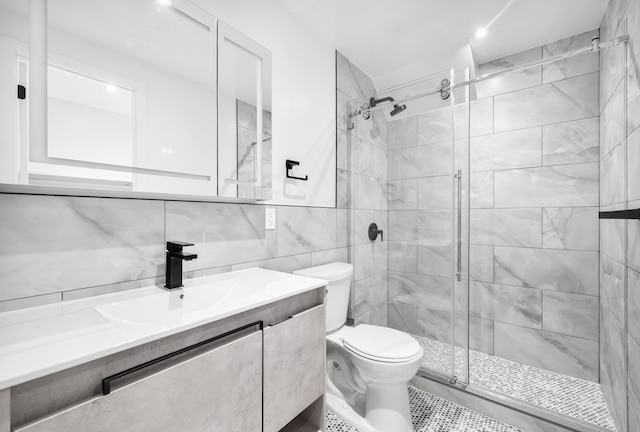 113 W 13th Street Building, New York City, NY 10011 - full bathroom featuring vanity, toilet, a stall shower, tile walls, and backsplash