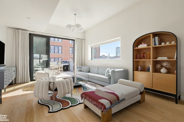 207 N 5th St Ph, Ph, New York City, NY 11211 - living room featuring wood finished floors and a chandelier